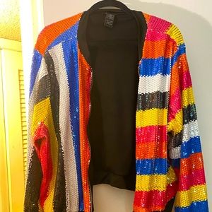 Sequin bomber style jacket. Zipper closure.